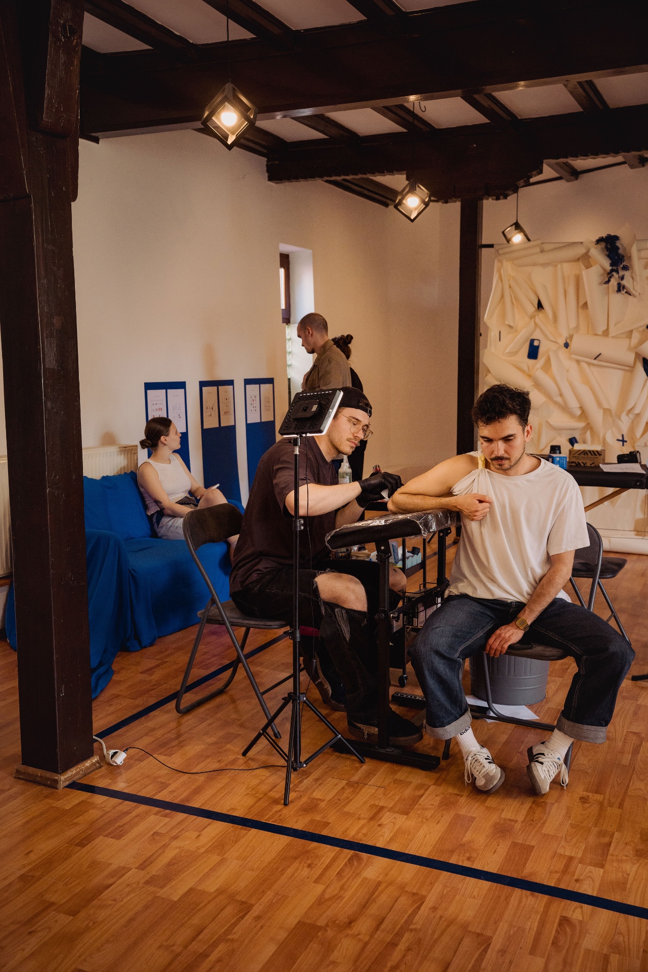 A tattoo session in progress at Alex Coseraru's Bucharest studio