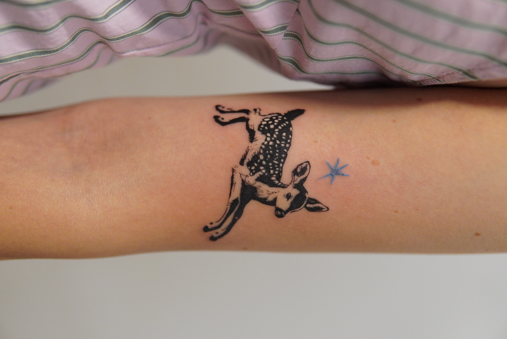 Delicate black and grey fawn tattoo
