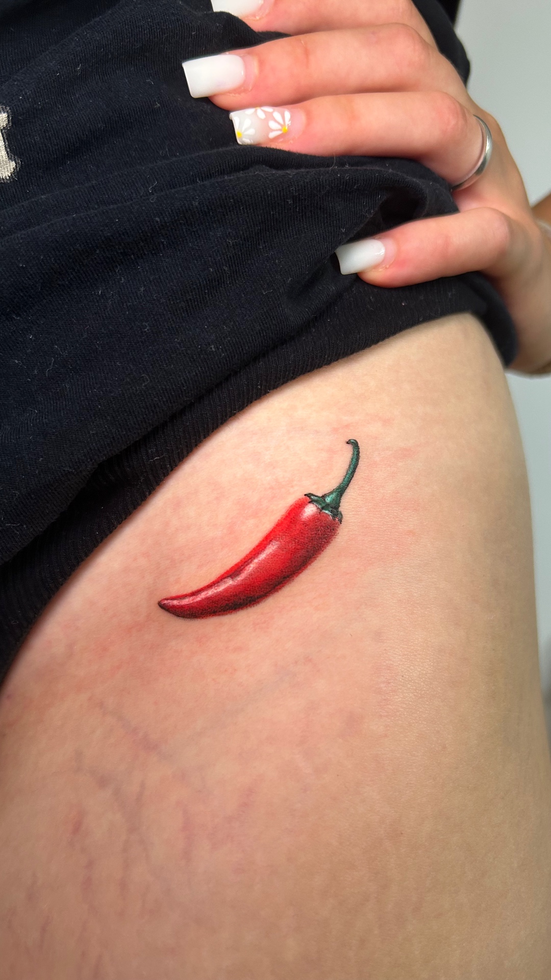 Fine line chili pepper tattoo
