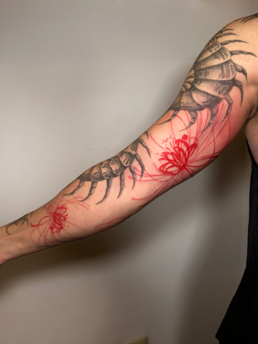 Black and grey centipede sleeve with red spider lilies