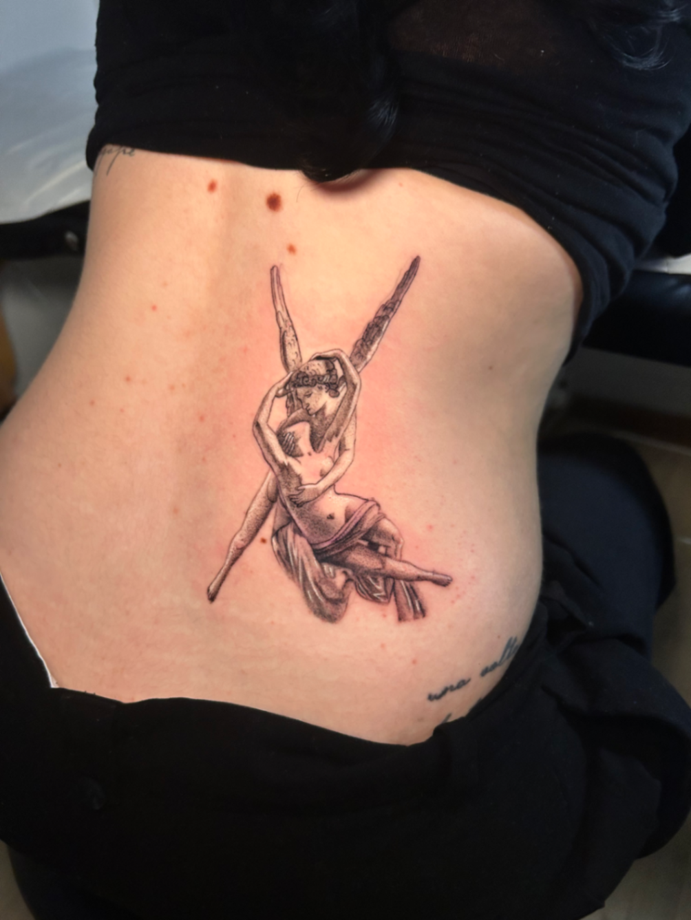 Micro realism tattoo of Psyche revived by Cupid's kiss