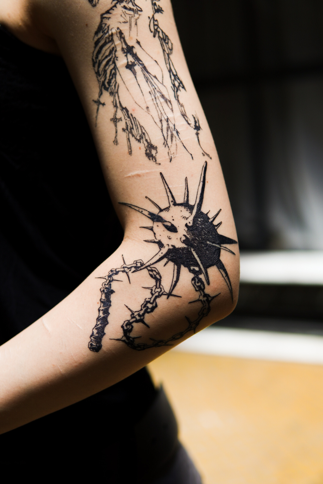 Blackwork thorn sun tattoo